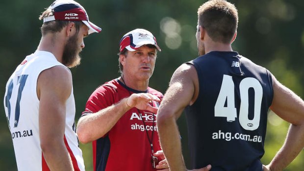 Doing the talking: Paul Roos (centre) with Max Gawn and Mark Jamar at Melbourne's training at Gosch's Paddock on Friday.