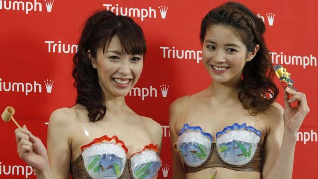 Models present lingerie maker Triumph's new concept bra, the 'Super Cool Bra'.