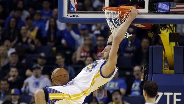 Flying high: Australian Andrew Bogut throws one down for the Warrios in their win over Orlando. 