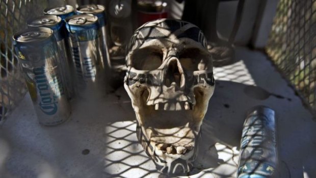 A skull is seen at the entrance of the town of Arteaga, in Michoacan State, Mexico, where Servando Gomez is known to throw lavish parties.