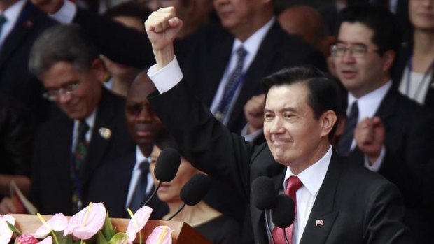Taiwan's President Ma Ying-jeou, front, raises his fist during National Day celebrations marking the 103rd anniversary of the founding of the Republic of China in Taipei, Taiwan.