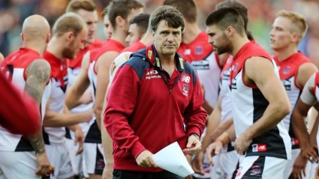 Paul Roos maps out strategy with his team during the game on Saturday.