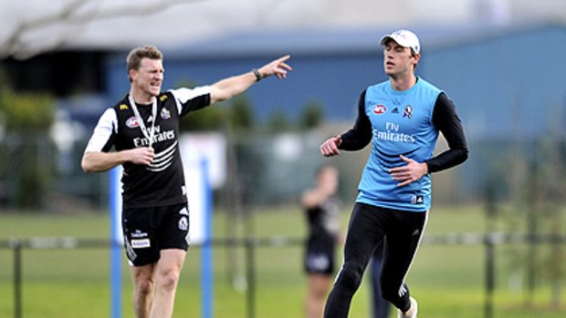 Collingwood coach-in-waiting Nathan Buckley barks the orders as out-of-form ruckman Josh Fraser attempts to impress at training. Fraser is in the mix to replace the suspended Travis Cloke when the Pies play St Kilda on Saturday.