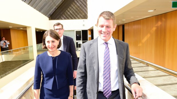Mike Baird and Gladys Berejiklian arrive for the Liberal Party meeting on Monday.