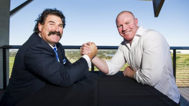 Robert Dipierdomenico and Barry Hall arm-wrestle at the AFL grand final lunch in Canberra on Tuesday.