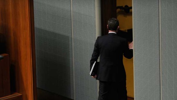 Mustn't call the Prime Minister ''hopeless'' ... Christopher Pyne leaves the chamber after being ejected by the Speaker.