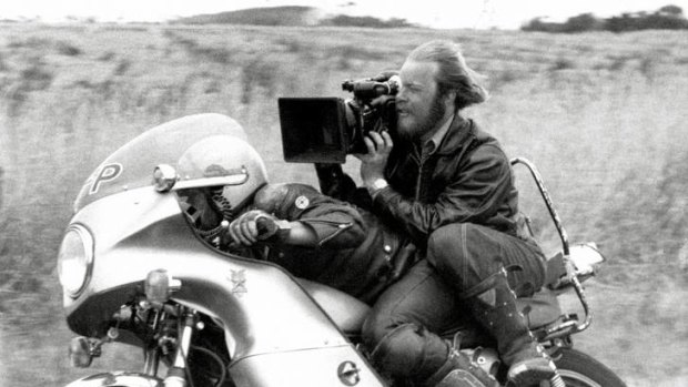 Terry Gibson (stuntie) driving, David Eggby (DOP) during filming of Mad Max (1979). Courtesy David Eggby