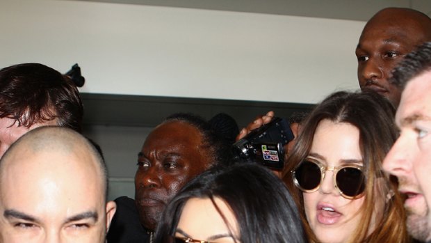 Frenzy ... Kim Kardashian and sister Khloe arrive in Australia.