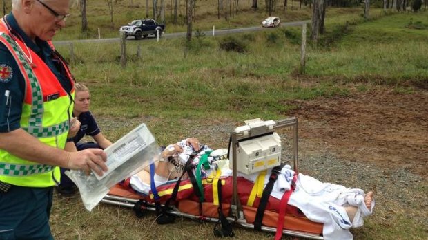 Paramadics prepare to airlift an International Rally of Queensland competitor to hospital.