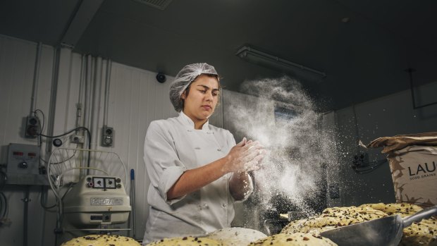 Flute Bakery apprentice pastry chef Elsie Savvoudiou prepares hot cross buns.