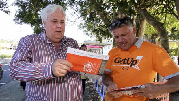 Clive Palmer with a booth volunteer - but not for his party