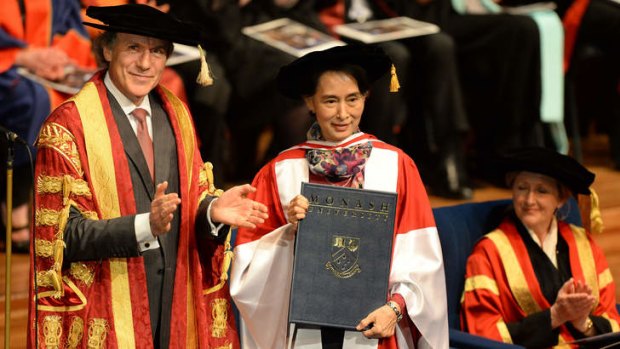Myanmar's democracy leader Aung San Suu Kyi receives an honorary Doctor of Laws from Monash University chancellor Alan Finkel.
