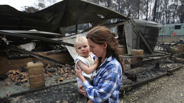 Reunited: Jennifer Wood with son Jack. Ms Wood, who was not allowed back into Narbethong Saturday, endured an excrutiating wait for news about her 15-month-old son and her partner, Mark.