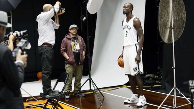 New colours: Brooklyn Nets forward Kevin Garnett poses for photos during the team's NBA basketball media day at the Barclays Center in the Brooklyn borough of New York.