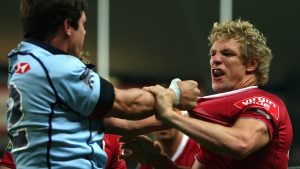 Tom Carter of the Waratahs has an altercation with Peter Hynes of the Reds during the round four Super 14 match between Queensland and New South Wales at the Sydney Football Stadium on March 6, 2009.