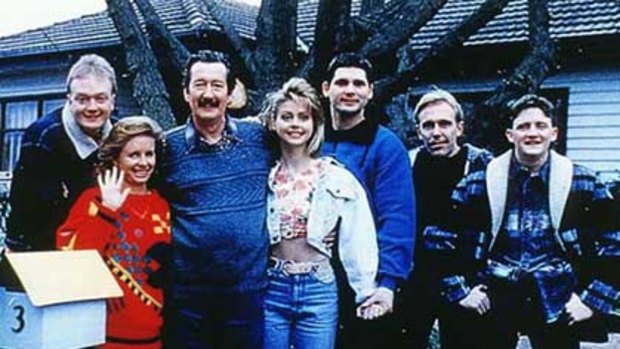 The cast of The Castle in front of the house.