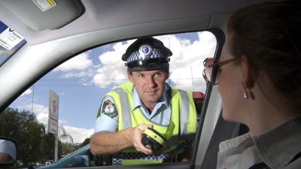 Senior Constable David Rixon, photographed on duty during highway patrol in 2007, was shot and killed in Tamworth today.