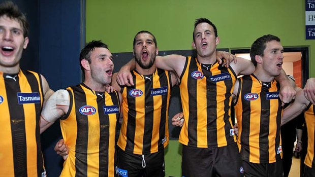 On song: 'Buddy' Franklin, centre, celebrates with teammates after Hawthorn's spirited victory over the Lions in Launceston.