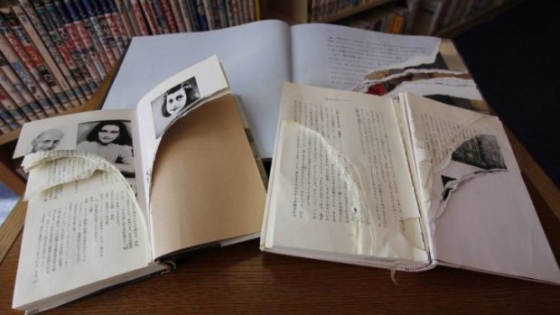 Vandalism: Torn copies of Anne Frank's "Diary of a Young Girl" and related books at Shinjuku City Library in Tokyo.