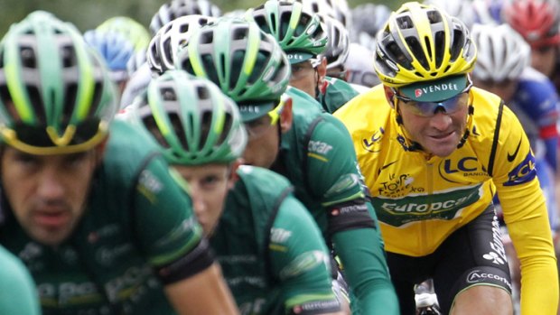 Vanguard ... yellow jersey holder Thomas Voeckler of France rides behind his Europcar teammates in the main pack during the 13th stage of the Tour de France, which was won by Norway's Thor Hushovd.