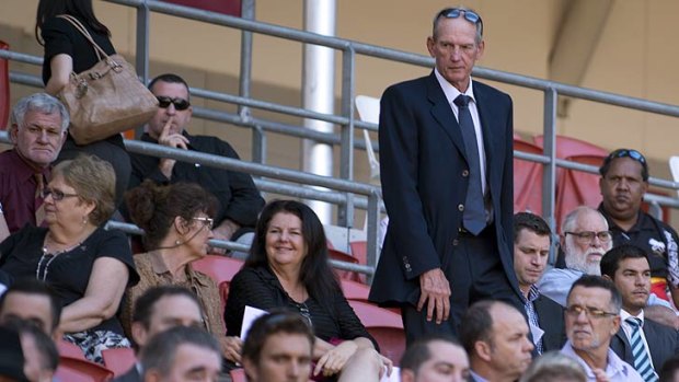 Wayne Bennett joins mourners at Suncorp Stadium for Ross Livermore's memorial.