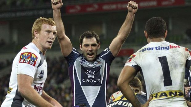 Cameron Smith of the Storm celebrates a try.