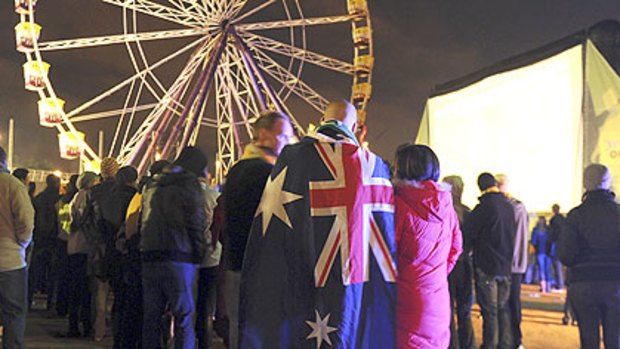 Cool world: It's 4am and the crowd builds at Birrarung Marr to watch Australia's World Cup opener against Germany.