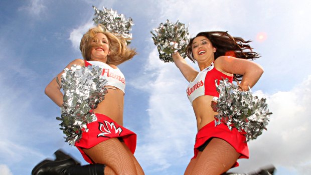 Lifting the game ... Illawarra St George Dragons cheerleaders Lauren Chikitch and Alex McKeon.