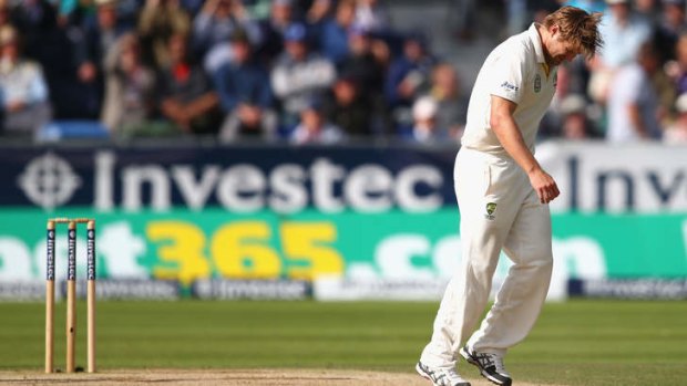 Blow for Australia: Shane Watson picks up an injury while bowling.