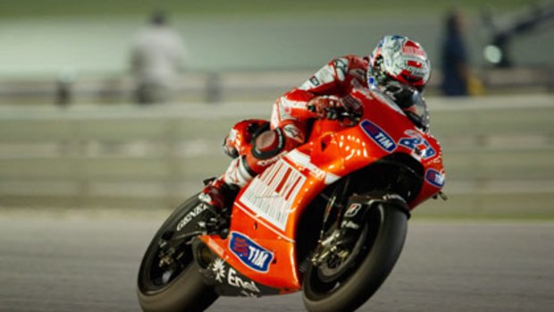Casey Stoner lifts his front wheel during the free practice session at the Losail circuit in Doha, Qatar.