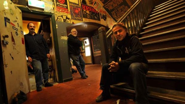 New publicans  Sam Crupi, Jon Perring and Andrew Portokallis in the refurbished but familiar interior of  Collingwood's Tote pub.