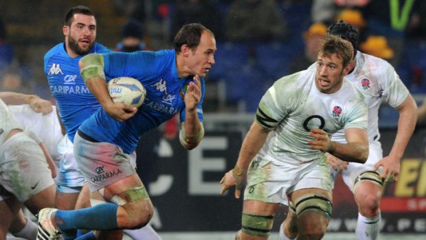 Man of the match ... Italy's captain Sergio Parisse charges at England's skipper Chris Robshaw.