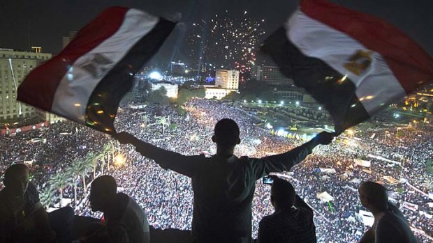 Supporting the military: Demonstrators opposed to ousted president Mohamed Mursi in Tahrir Square on Friday.
