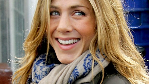 The art of the scarf ... Jennifer Aniston dresses up a ski jacket.