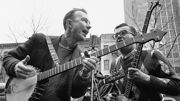 Pete Seeger, left, performing at the Rally for Detente at Carnegie Hall in New York.