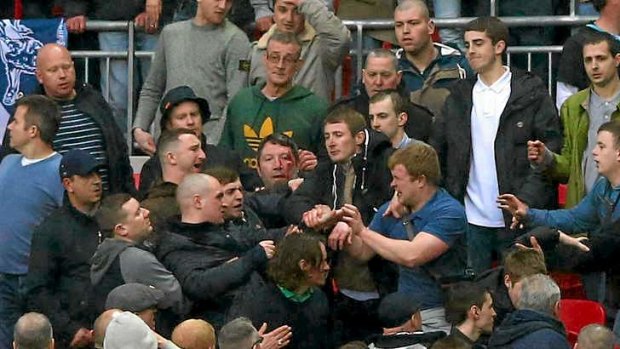 Trouble breaks out between Millwall supporters.