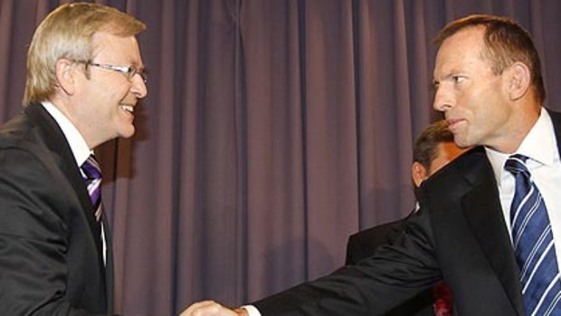 Shake before being stirred ... Kevin Rudd and Tony Abbott before the debate got underway.