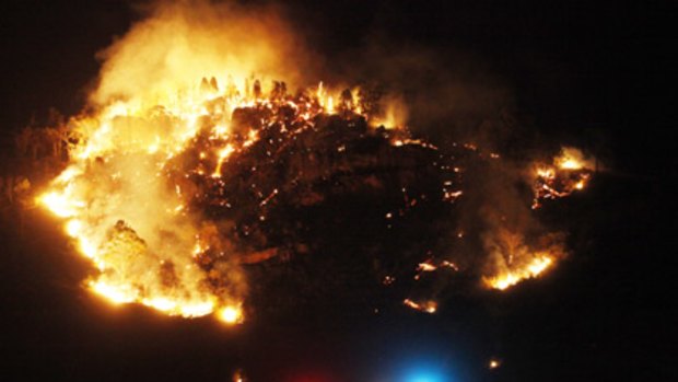 Strong wind fans flames in the central west ...  a bushfire threatens the outskirts of  Rylstone, where patients at the local hospital had to be evacuated.