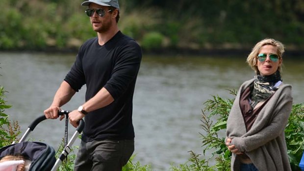 Walk in the park: Chris Hemsworth and Elsa Pataky on the banks of the river Thames with daughter India and newborn twin boys Tristan and Sasha.