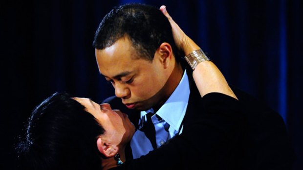 Tiger Woods kisses his mother, Kultida Woods, after making his statement.