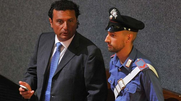 Costa Concordia's captain Francesco Schettino, left, prepares for his trial for manslaughter.