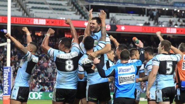 Victory: Jonathan Wright is hoisted high by his Sharks teammates after his last-minute match-winning tackle.