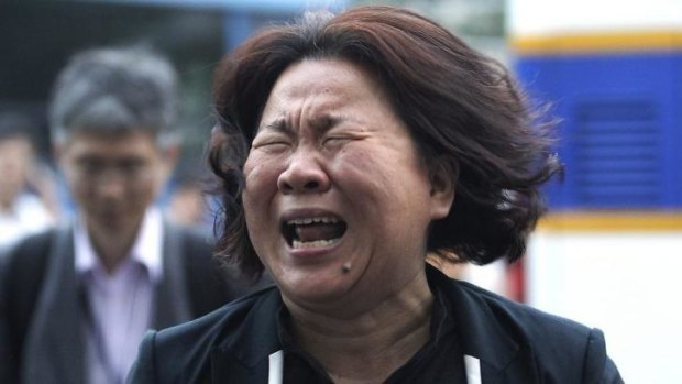 Heartbroken ... A family member of a passenger aboard the sunken ferry Sewol cries after a pretrial hearing of crew members of the ferry at Gwangju District Court in Gwangju.