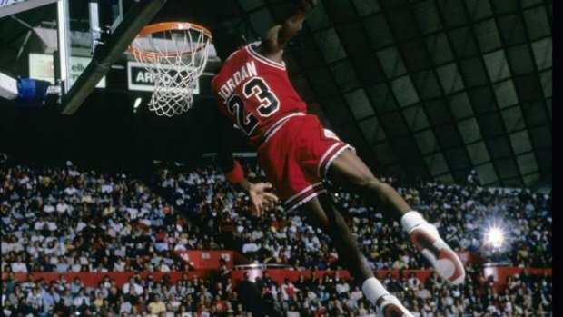 Jordan makes a spectacular dunk in the late eighties for the Chicago Bulls.