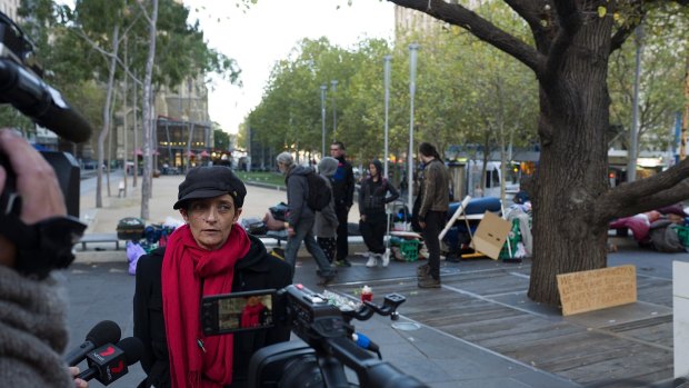 MELBOURNE, AUSTRALIA - MAY 20:  Protest spokesperson Lisa Peterson speak to the media as City of Melbourne officers are seen dismantling the milk crate structures being used as shelter by homeless protesters in the City Square on May 20, 2016 in Melbourne, Australia.  (Photo by Jesse Marlow/Fairfax Media)