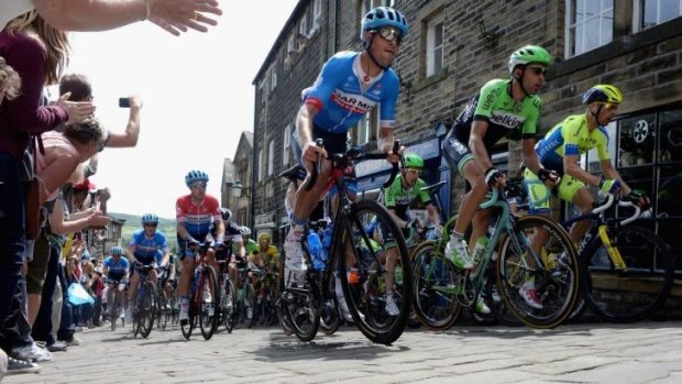 The peloton rides the cobbles of Haworth during the second stage of the Tour de France.