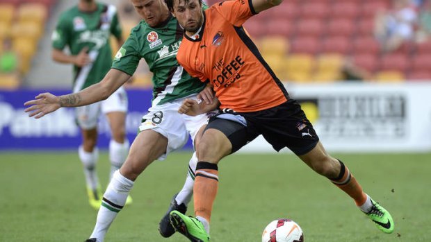 Thomas Broich of the Roar and Ruben Zadkovich of the Jets