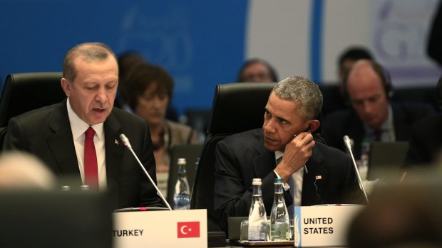 Barack Obama looks on as Turkish President Recep Tayyip Erdogan, left, presides over a session of the G20 summit. Turkey and the European Union have pushed for the migration crisis to be made part of the summit's global agenda.