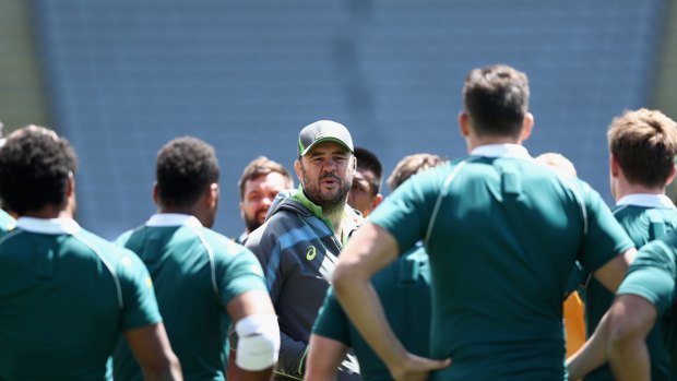 Coach Michael Cheika speaks to his players during the captain's run at Eden Park on Friday.