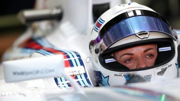You go girl: Development driver Susie Wolff of Great Britain and Williams sits in her car at Hockenheim.